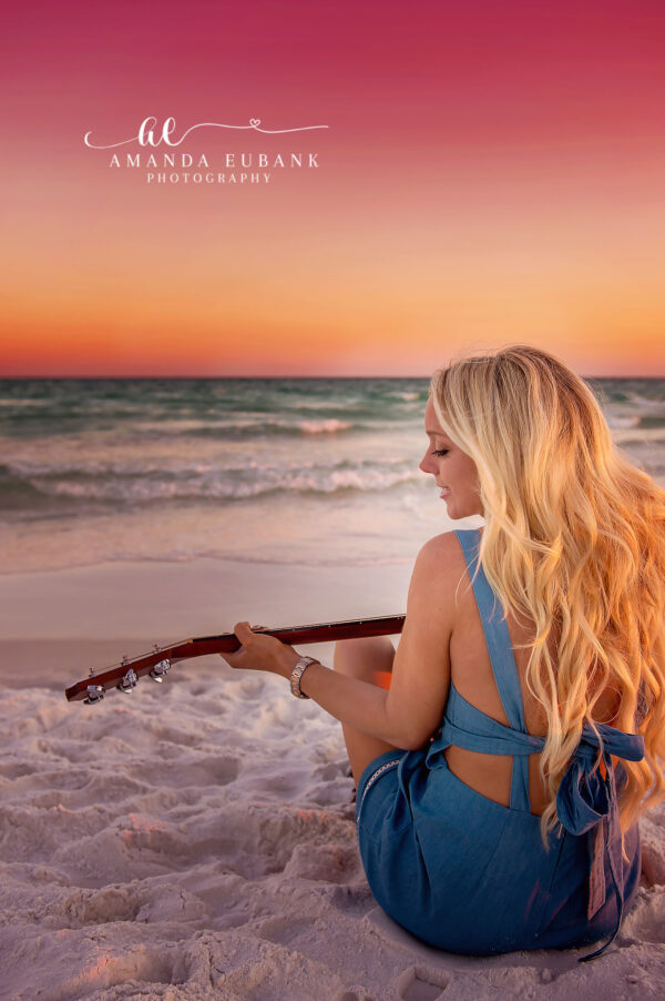 Beachside Senior Portrait with Guitar at Pink Sunset in Seaside Florida Seaside senior photographer captures senior playing guitar on the beach at vibrant pink sunset